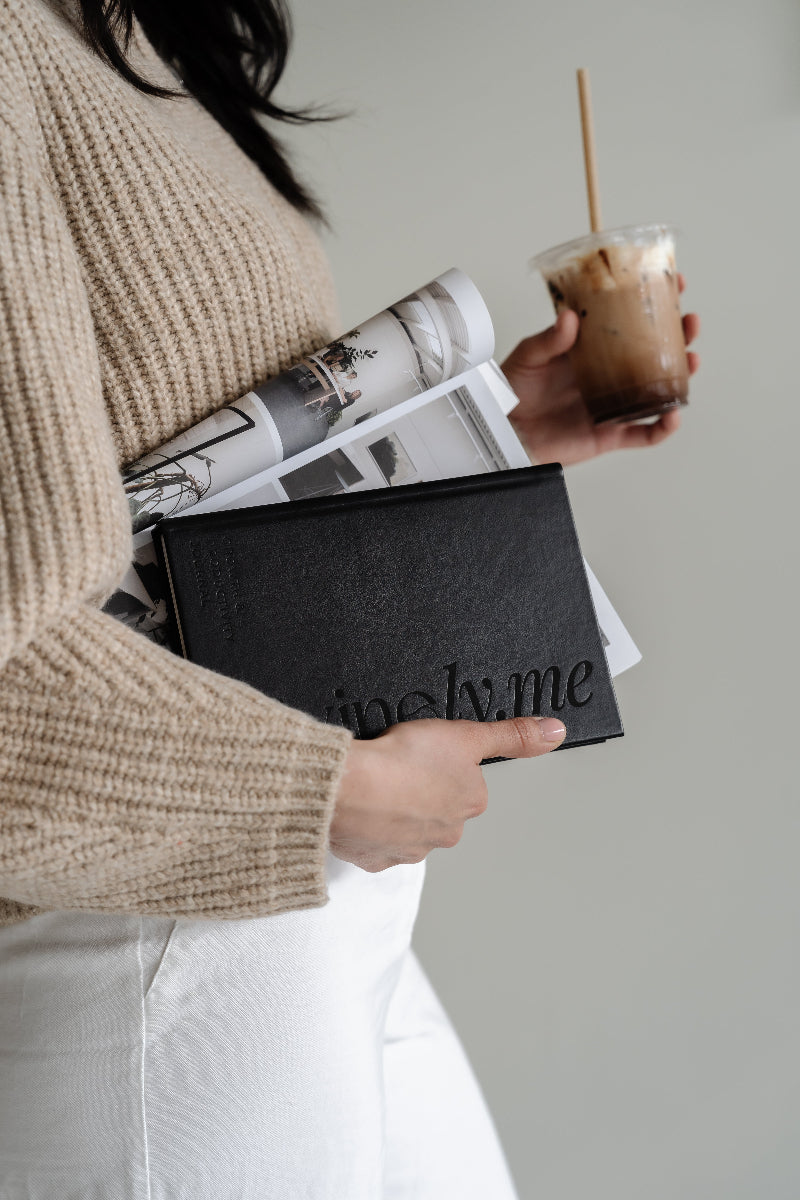 Girl Holding the Luxury Growth & Productivity Journal in Black